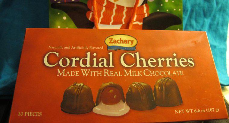 Che cosa chiamate caramelle rotonde o ovali piene di conserve di frutta o di crema e ricoperte di cioccolato?